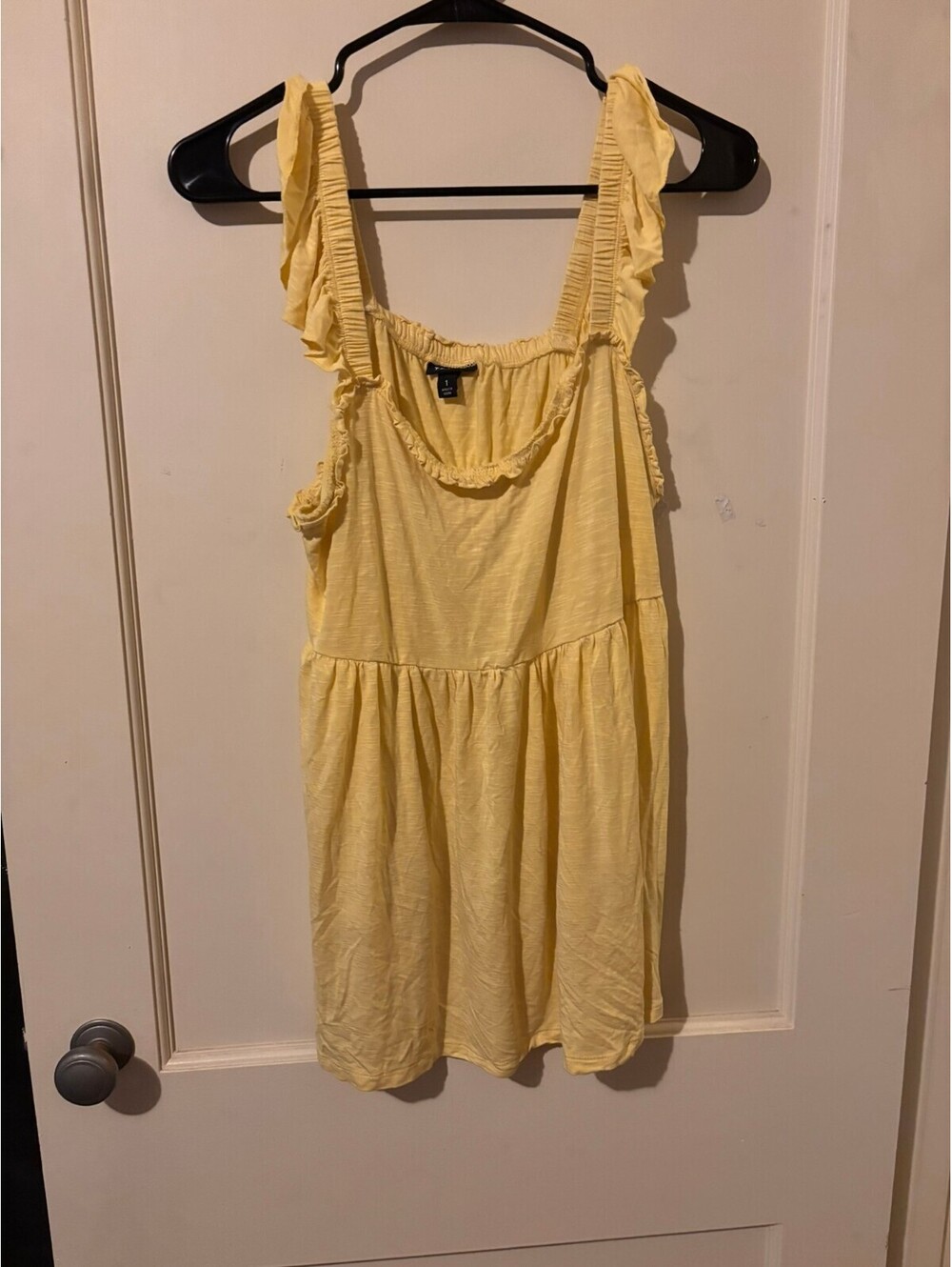 Torrid yellow sleeveless peplum top